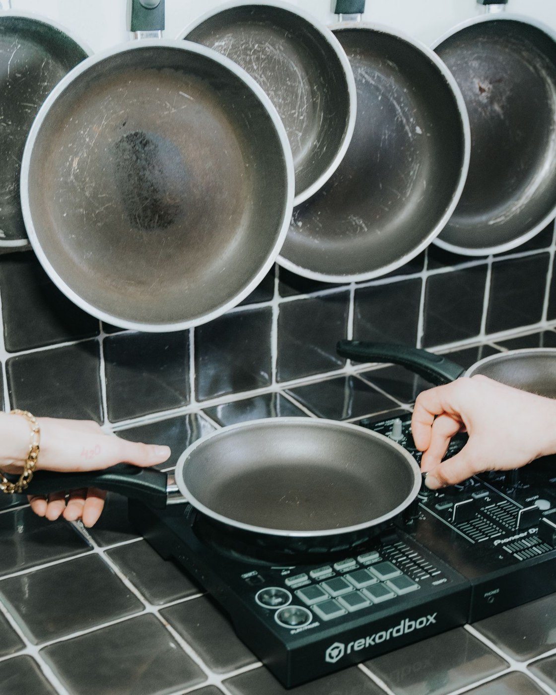 A frying pan on an electric cooking surface; the scene does not establish its induction compatibility.